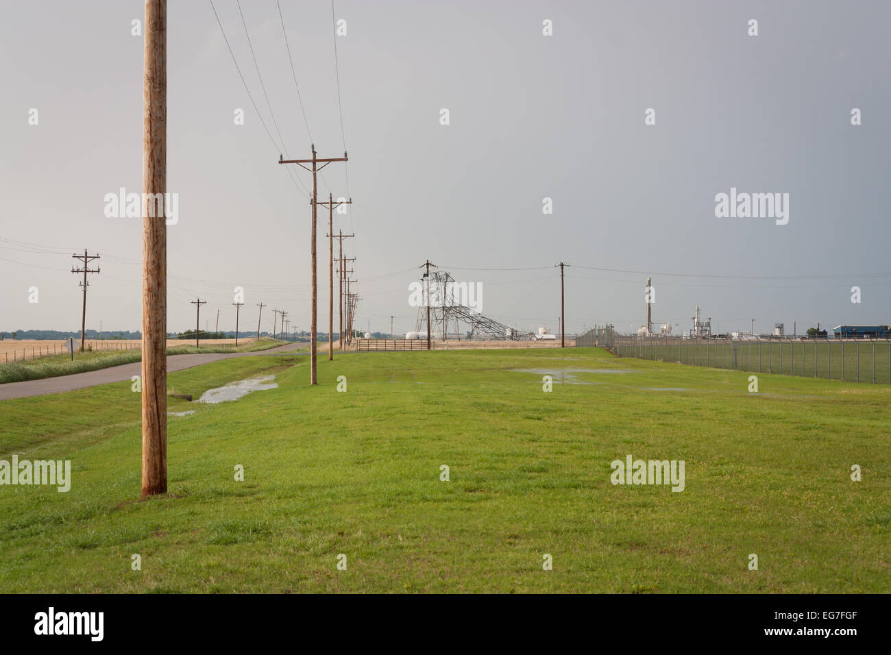 An metal truss electrical tower collapses after taking a direct strike from a powerful EF-5 tornado near Piedmont Oklahoma. Stock Photo