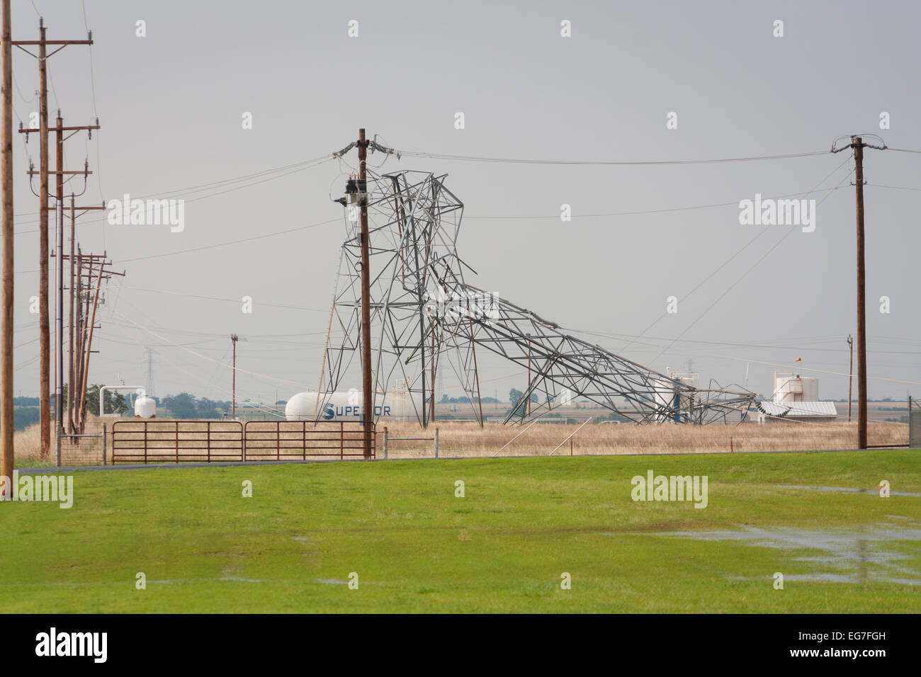 An metal truss electrical tower collapses after taking a direct strike from a powerful EF-5 tornado near Piedmont Oklahoma. Stock Photo