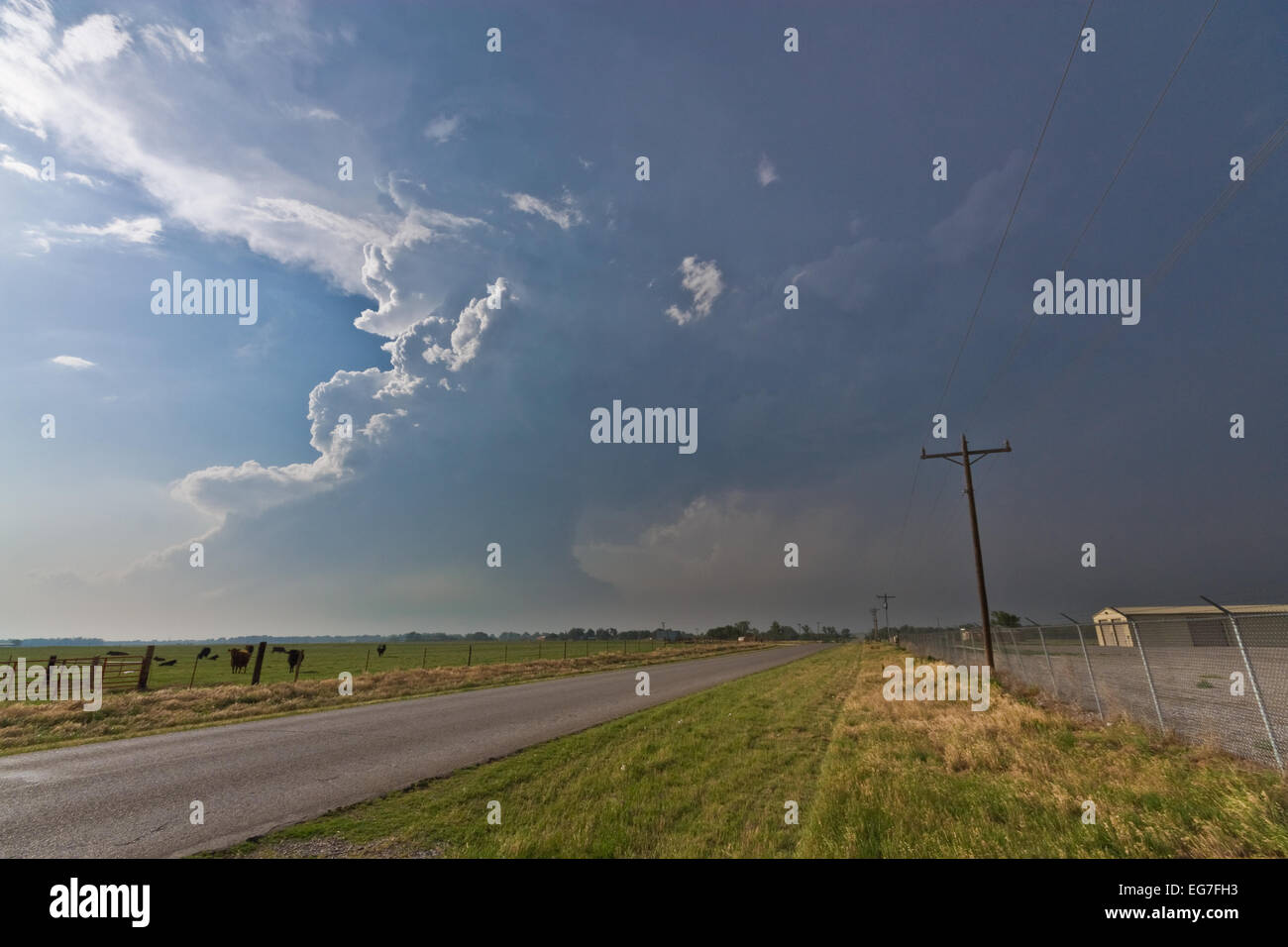 A powerful supercell thunderstorm takes shapes with a twisting updraft ...