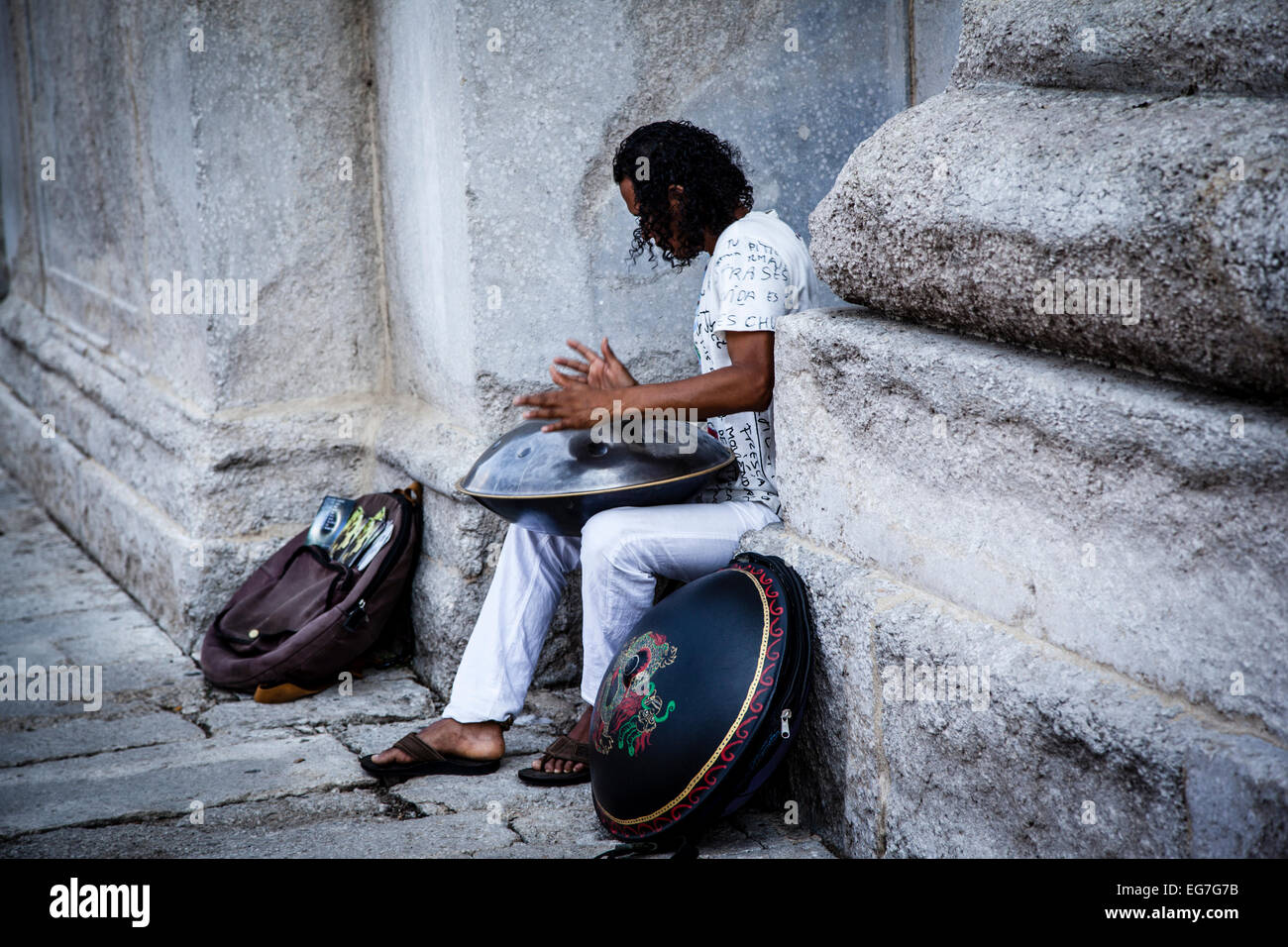 Street musician playing idiophone musical instrument named Hang Stock Photo
