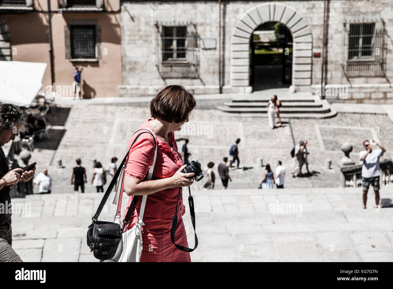 Tourist outside of the Church of Sant Feliu in Girona (Saint Felix). Spain Stock Photo