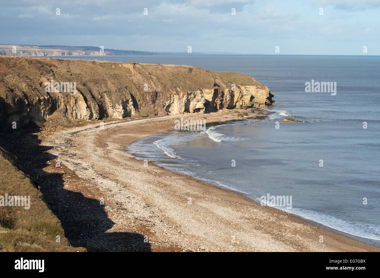 The beach and magnesium limestone cliffs at Blackhall Rocks, seen from the coastal path, County Durham, England, UK Stock Photo