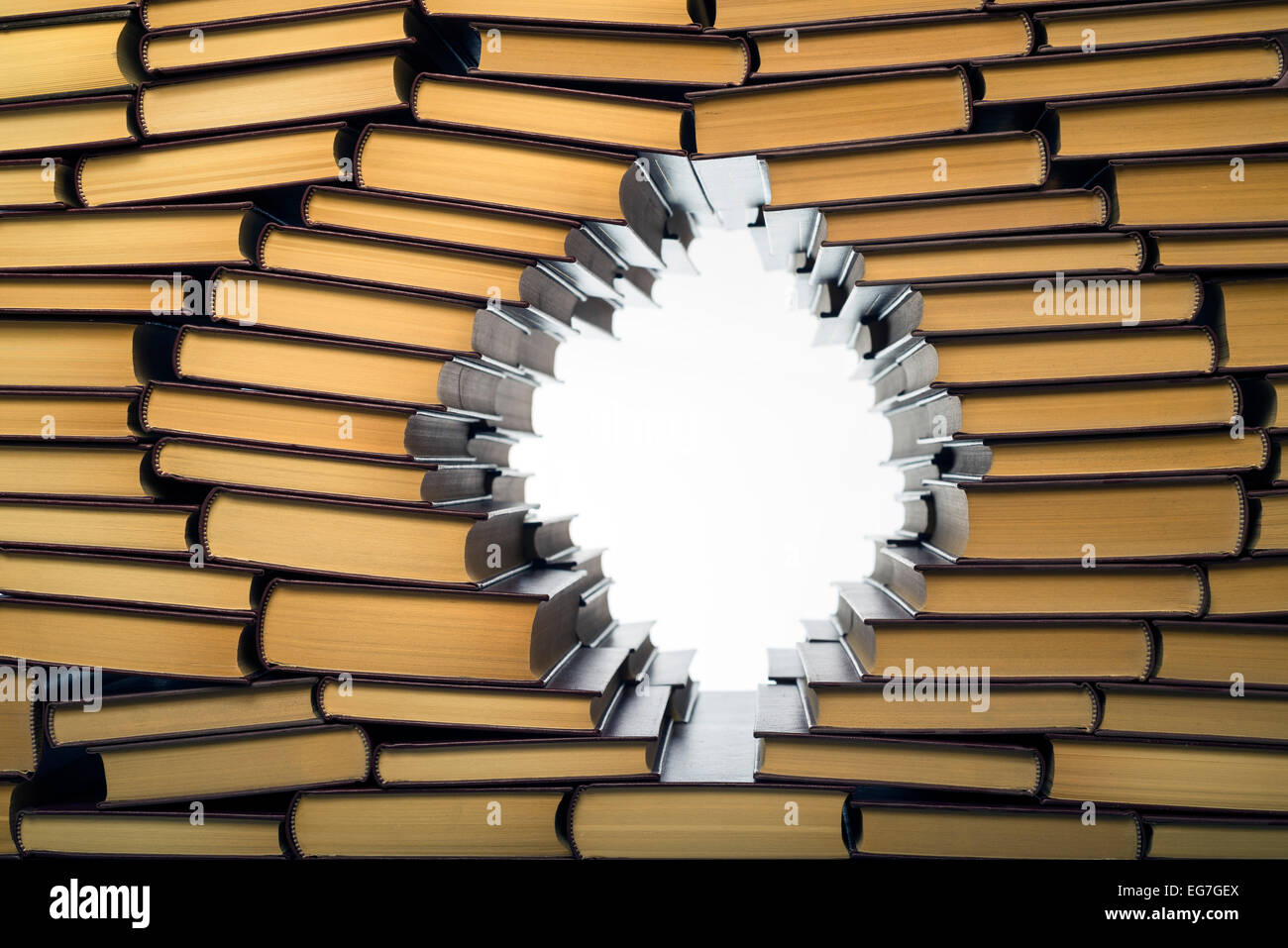 an open window in a wall of books Stock Photo