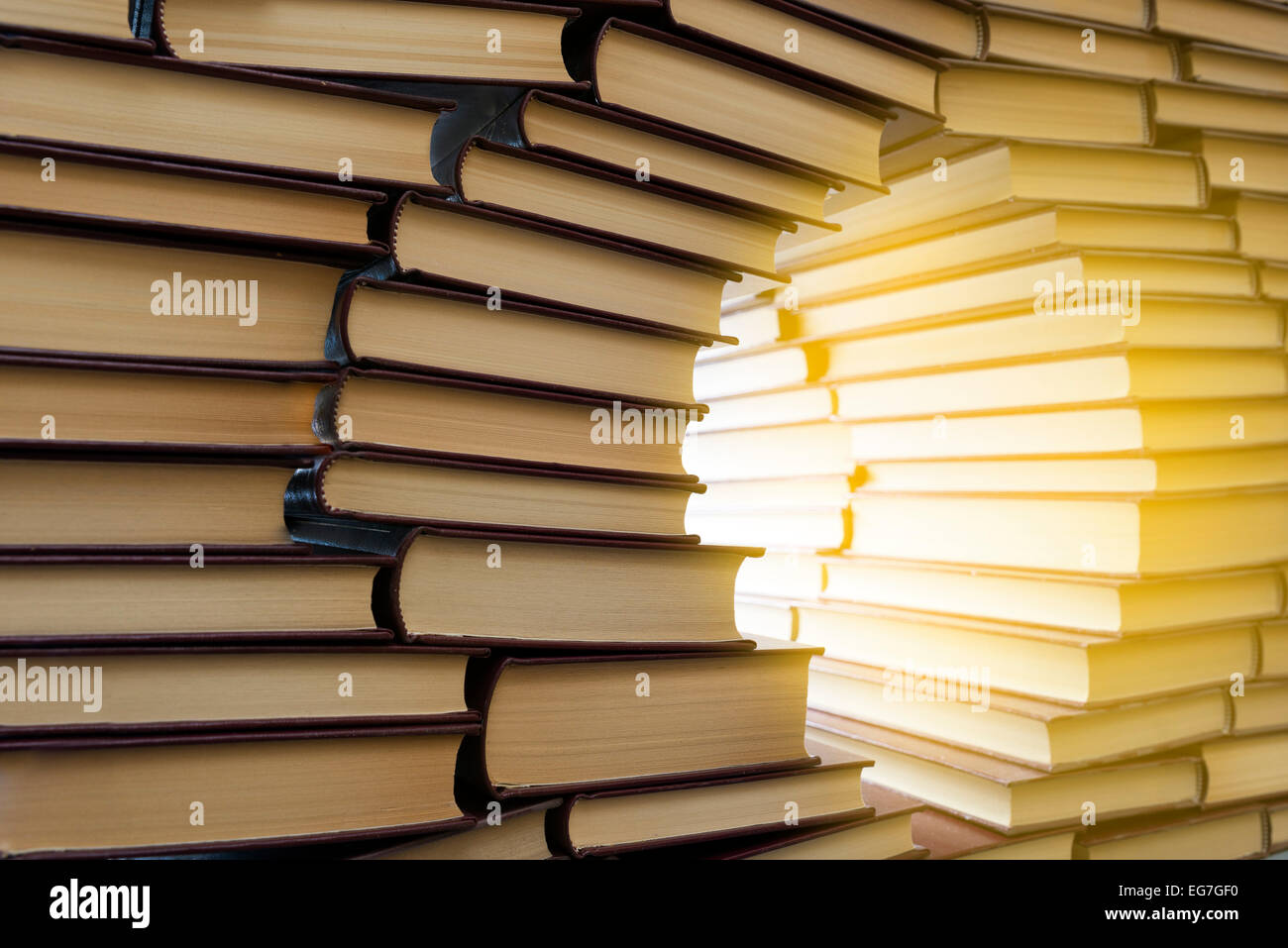 an open window in a wall of books Stock Photo