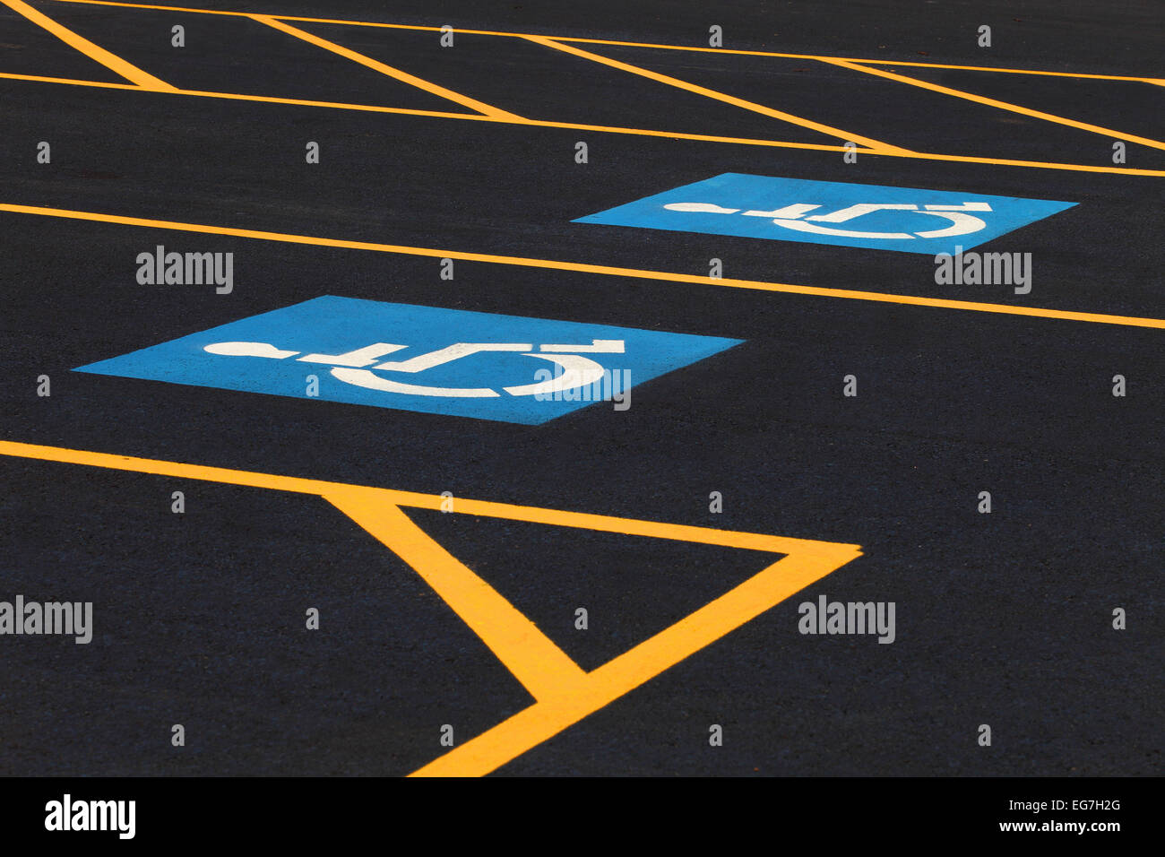 The international markings for a handicapped parking stall in a parking lot. Stock Photo