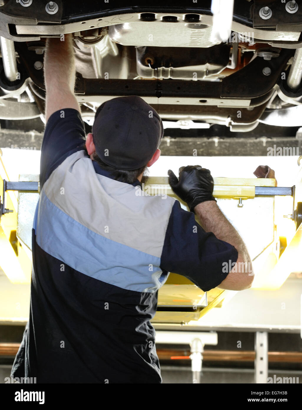 Changing the oil in a modern automobile. Stock Photo