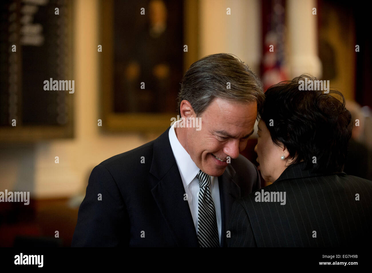 Texas House Speaker Joe Straus talks to a colleague in the House