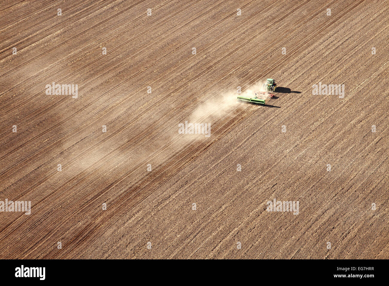 An aerial view of a farmer planting wheat in the fertile farm fields of Idaho. Stock Photo