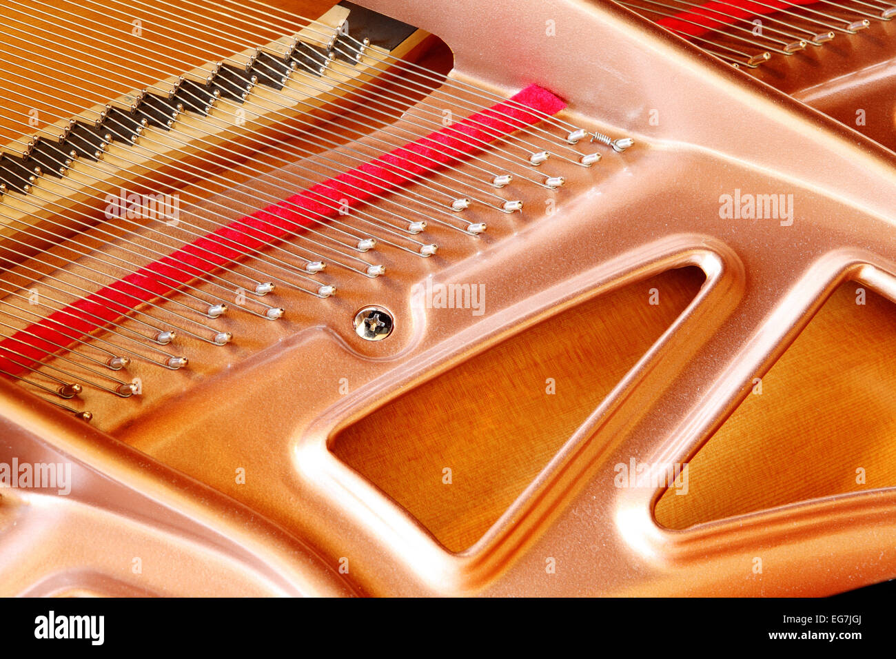 A closeup view of a modern soundboard in a grand piano. Stock Photo