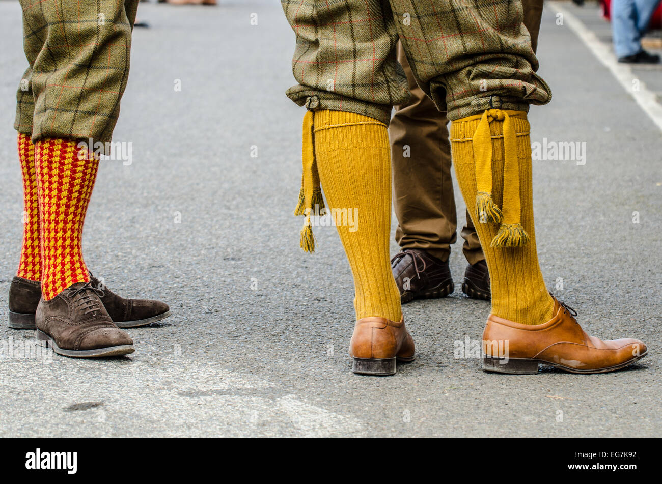 Plus-fours are breeches or trousers that extend 4 inches (10 cm) below the knee, with knee high socks. Vintage classic period attire Goodwood Revival Stock Photo
