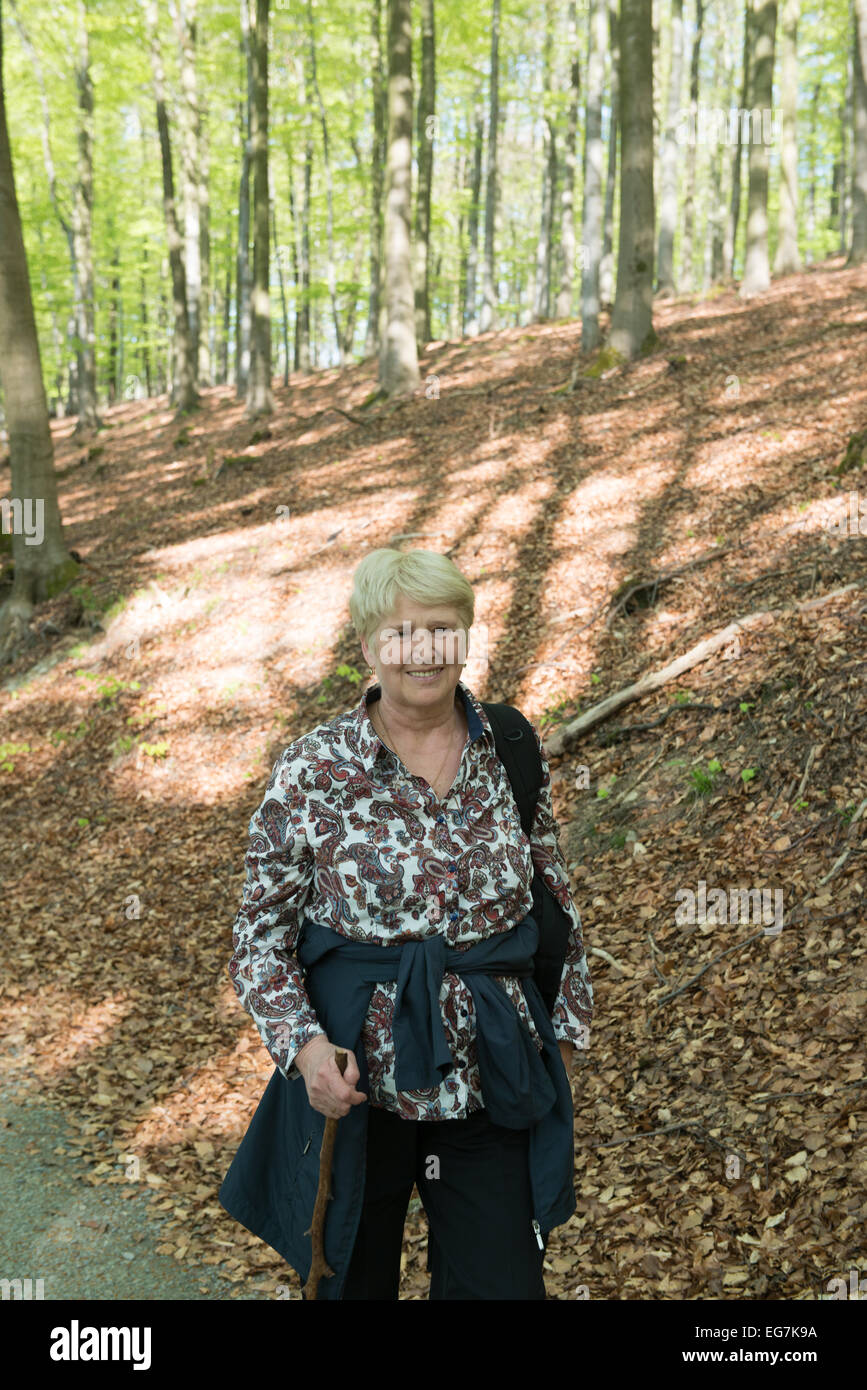 Old woman walking forest hi-res stock photography and images - Alamy