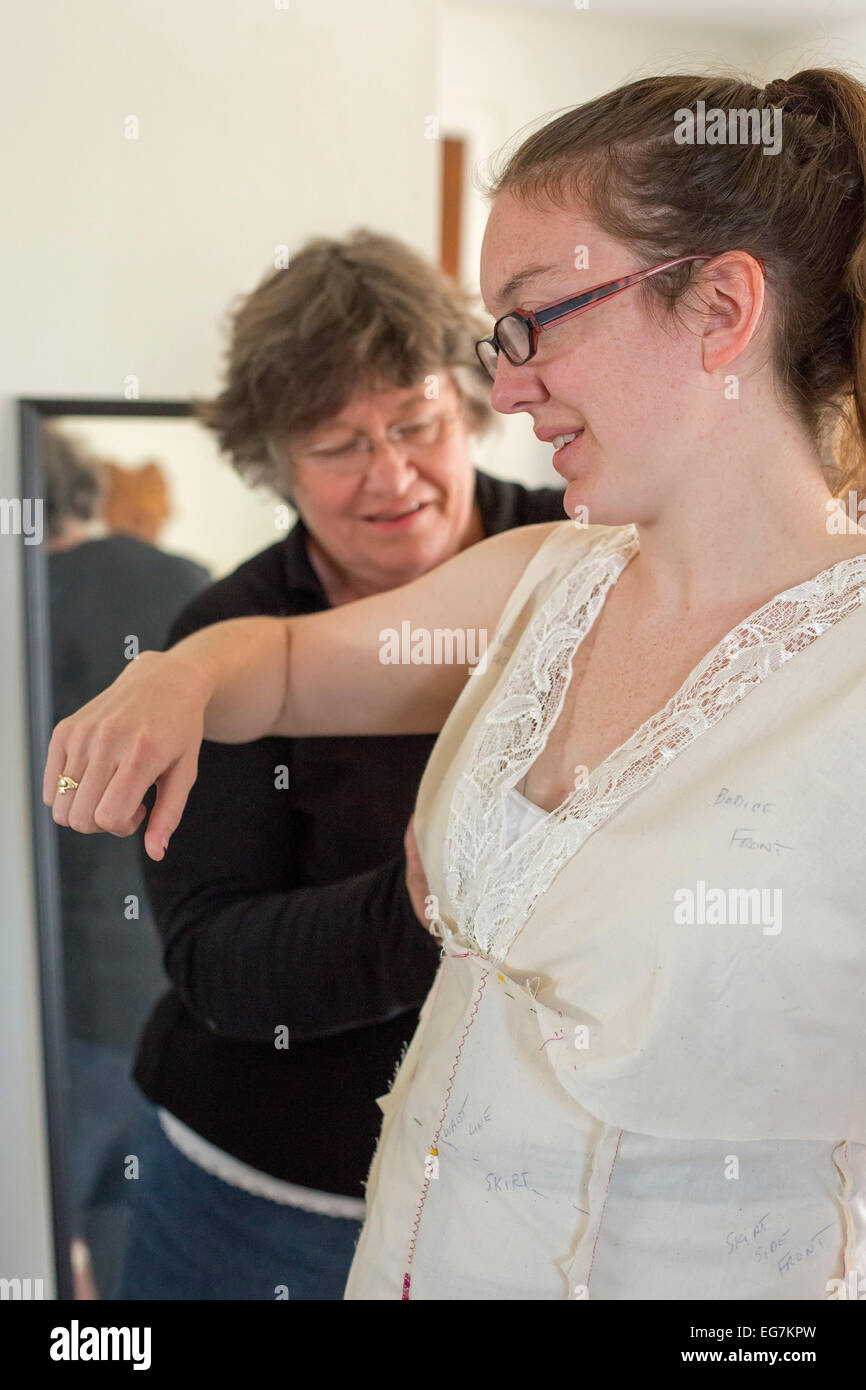 Broomfield, Colorado - A 27-year-old woman is fitted with a wedding dress. Stock Photo