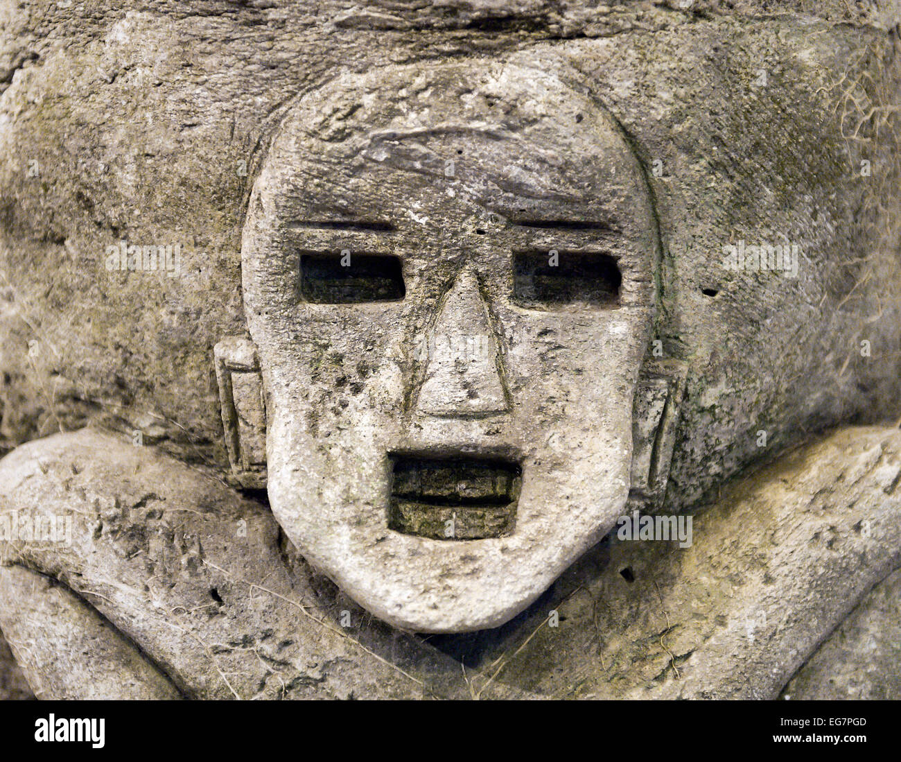 Ancient Asian stone carving of a man. Stock Photo