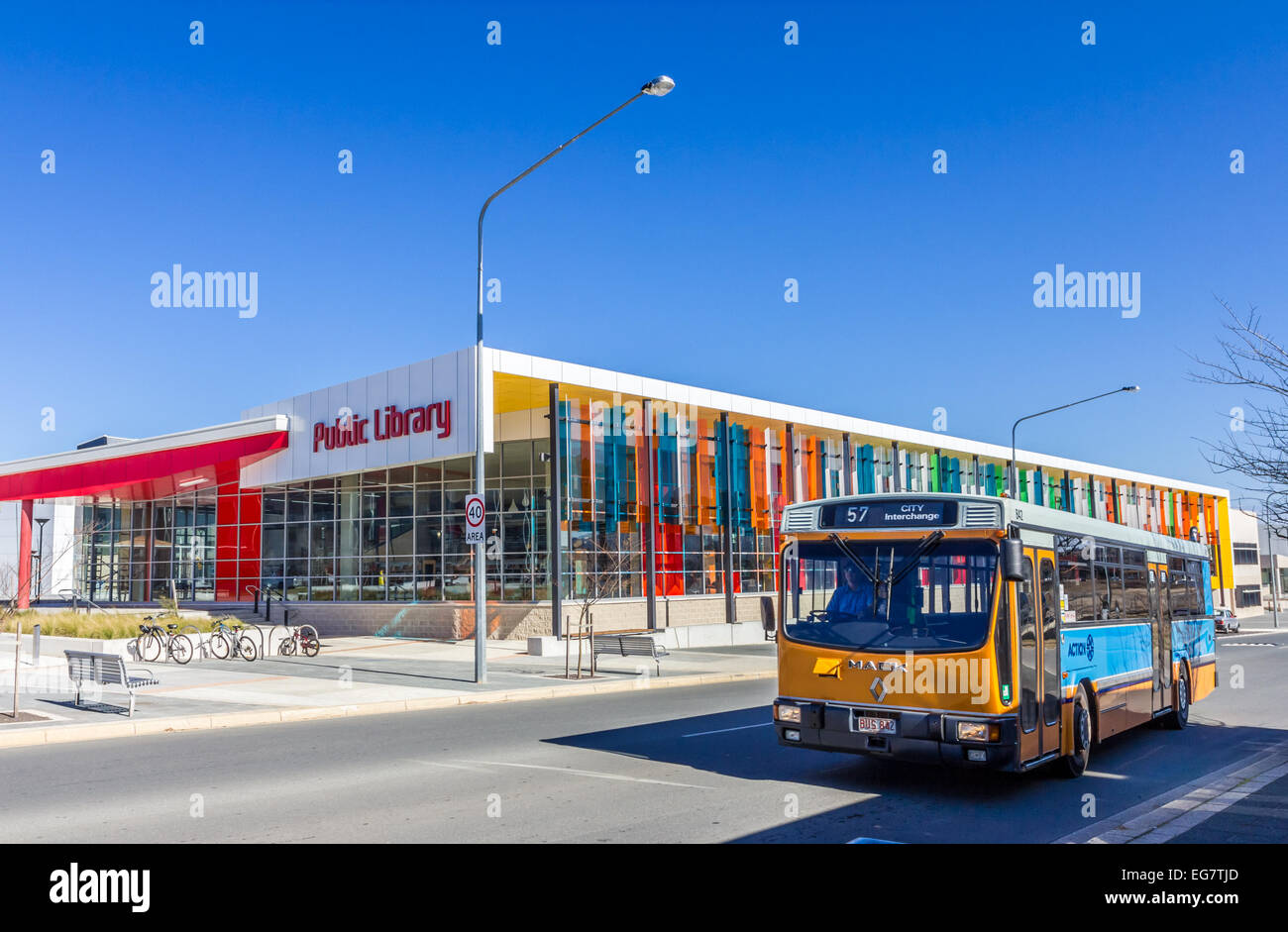 A bus drives past the Gungahlin Public Library, Canberra Australia Stock Photo
