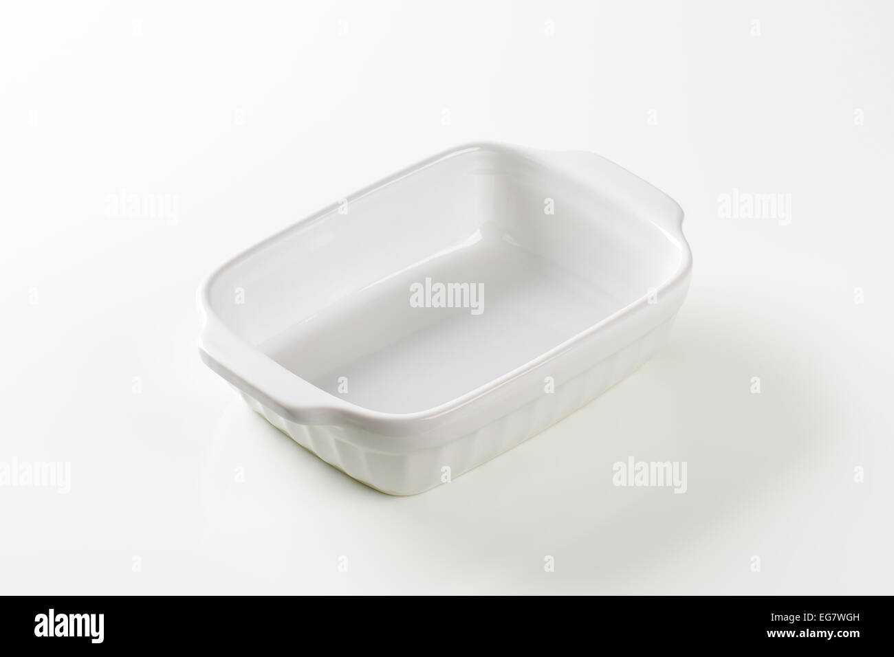 Classic white ceramic casserole dish with handles Stock Photo Alamy