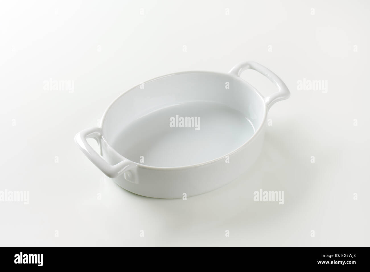 Deep oval baking dish with two handles Stock Photo Alamy