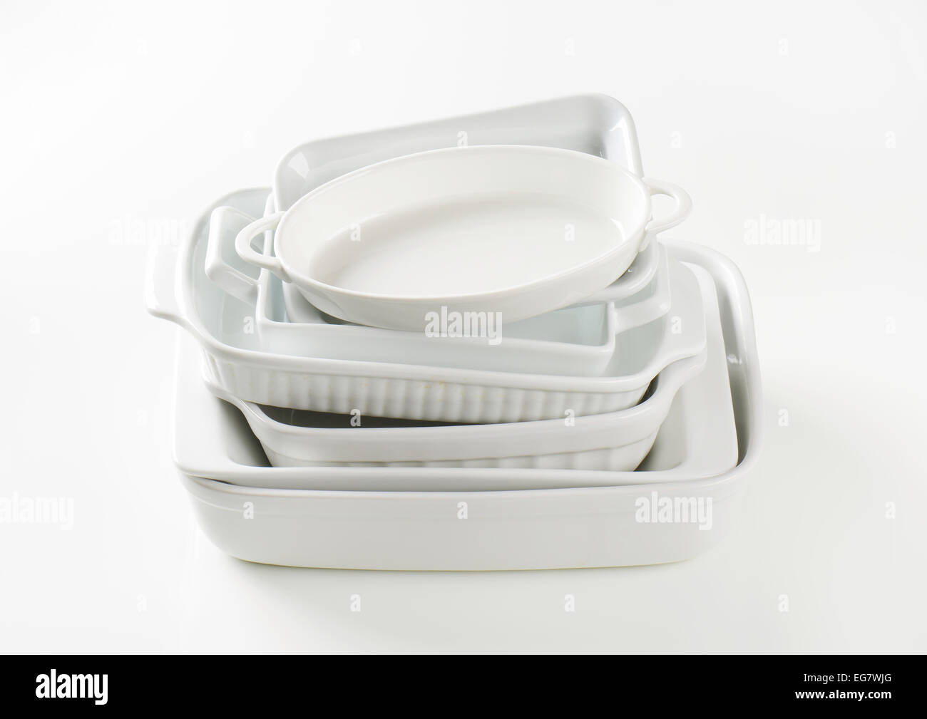 Stacked baking dishes of various sizes and shapes Stock Photo