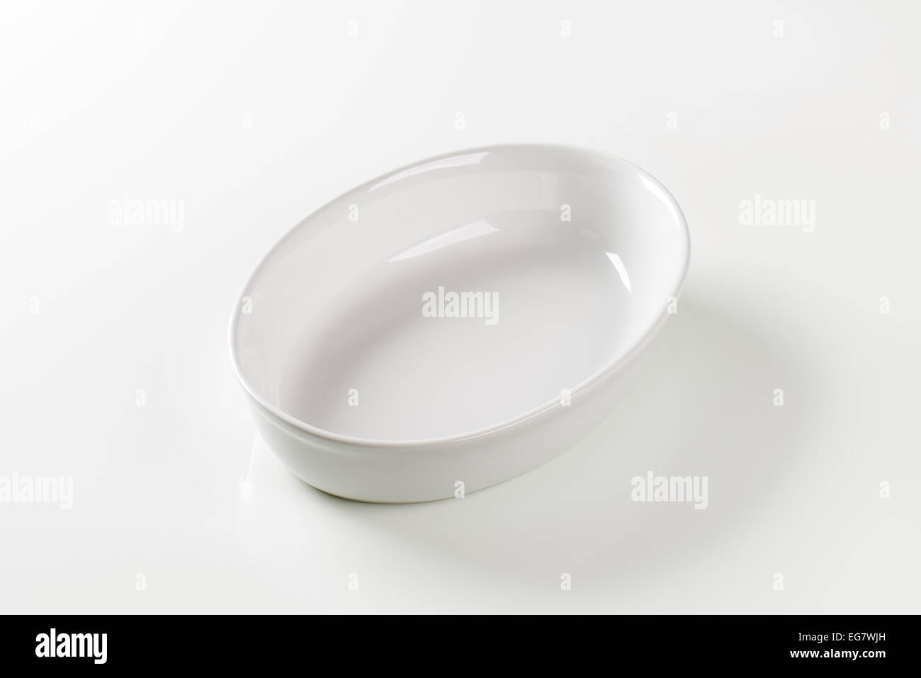 Empty deep oval porcelain dish Stock Photo