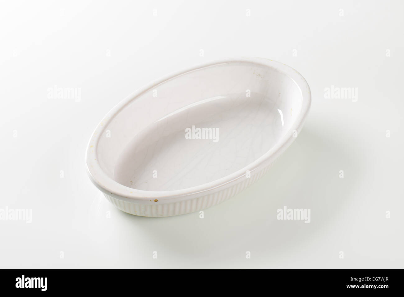 Empty deep oval porcelain dish Stock Photo
