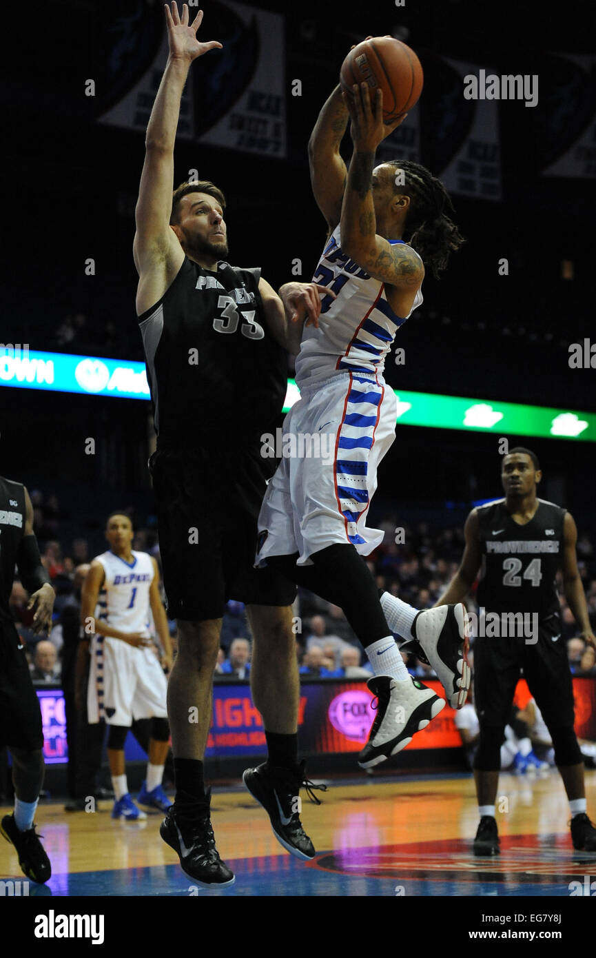Rosemont, Illionois, USA. 18th February, 2015. DePaul Blue Demons forward Jamee Crockett (21) takes a shot while Providence Friars forward Carson Desrosiers (33) attempts a block during the NCAA men's basketball game between the Providence Friars and the DePaul Blue Demons at the Allstate Arena in Rosemont, IL. Providence won 80-53 over DePaul. Credit:  Cal Sport Media/Alamy Live News Stock Photo