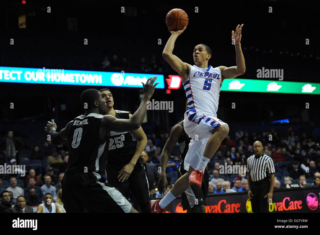 Rosemont, Illionois, USA. 18th February, 2015. DePaul Blue Demons guard Billy Garrett Jr. (5) takes a flying shot on basketball during the NCAA men's basketball game between the Providence Friars and the DePaul Blue Demons at the Allstate Arena in Rosemont, IL. Providence won 80-53 over DePaul. Credit:  Cal Sport Media/Alamy Live News Stock Photo