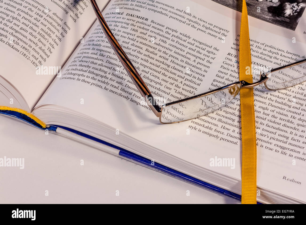 Open textbook with bookmark, shallow Depth of Field (DOF) Stock Photo