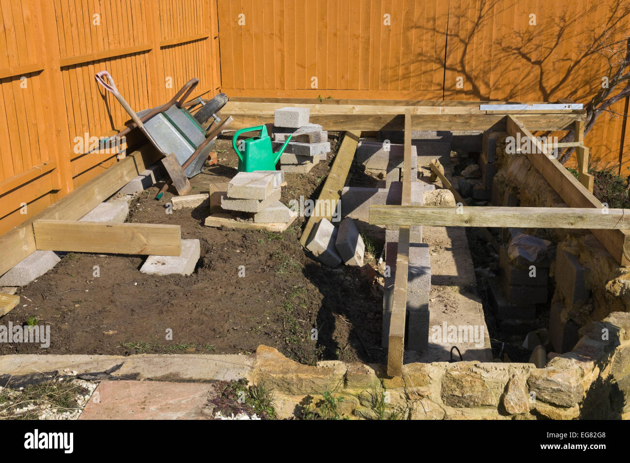 A decking project in an English garden. Foundations are being worked on