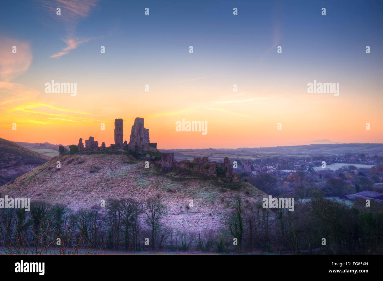 Winter pre-dawn colourful sunrise over Corfe Castle. Stock Photo