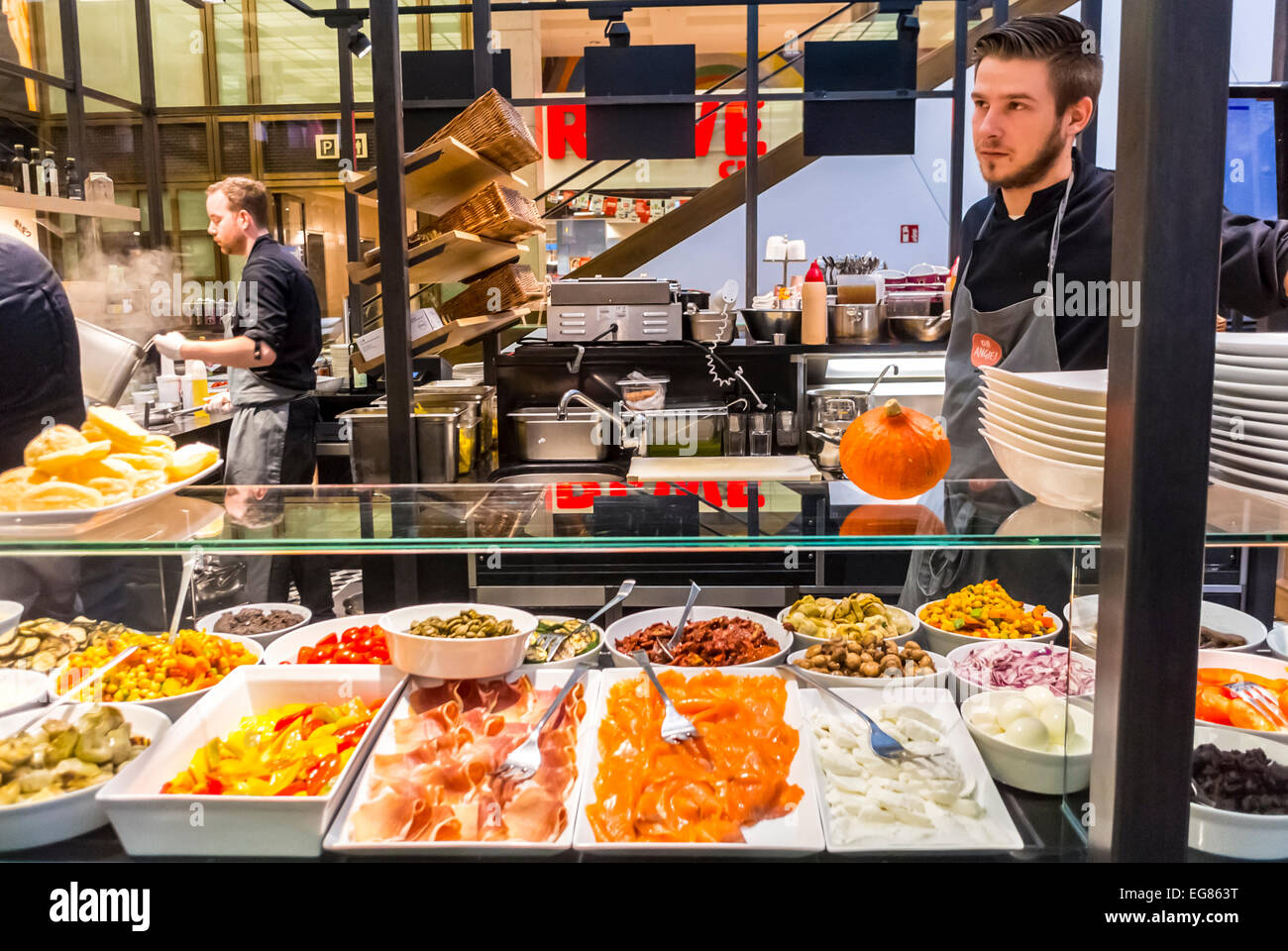 Berlin, Germany, Man Working, Preparing Food inside Cafeteria Spanish Food  Restaurant in Shopping Mall 
