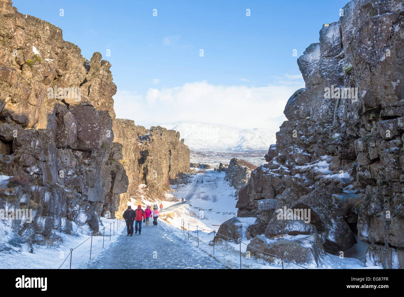 Tourists in the Allmannagja Gorge Þingvellir National Park in winter Iceland Europe Stock Photo