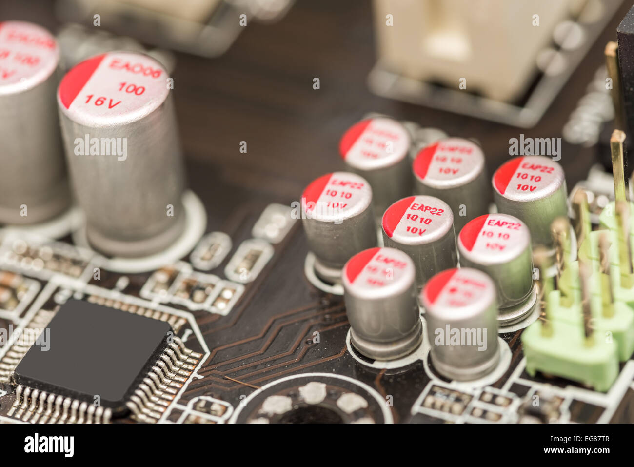 Computer Chip Capacitors And Resistors On Motherboard Stock Photo