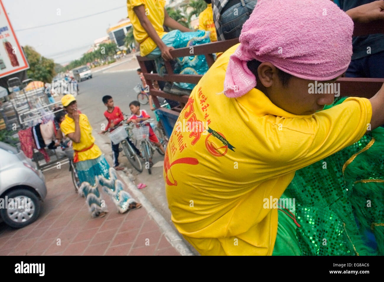 A man is getting out of a truck to perform a show on Chinese New Year in Kampong Cham, Cambodia. Stock Photo