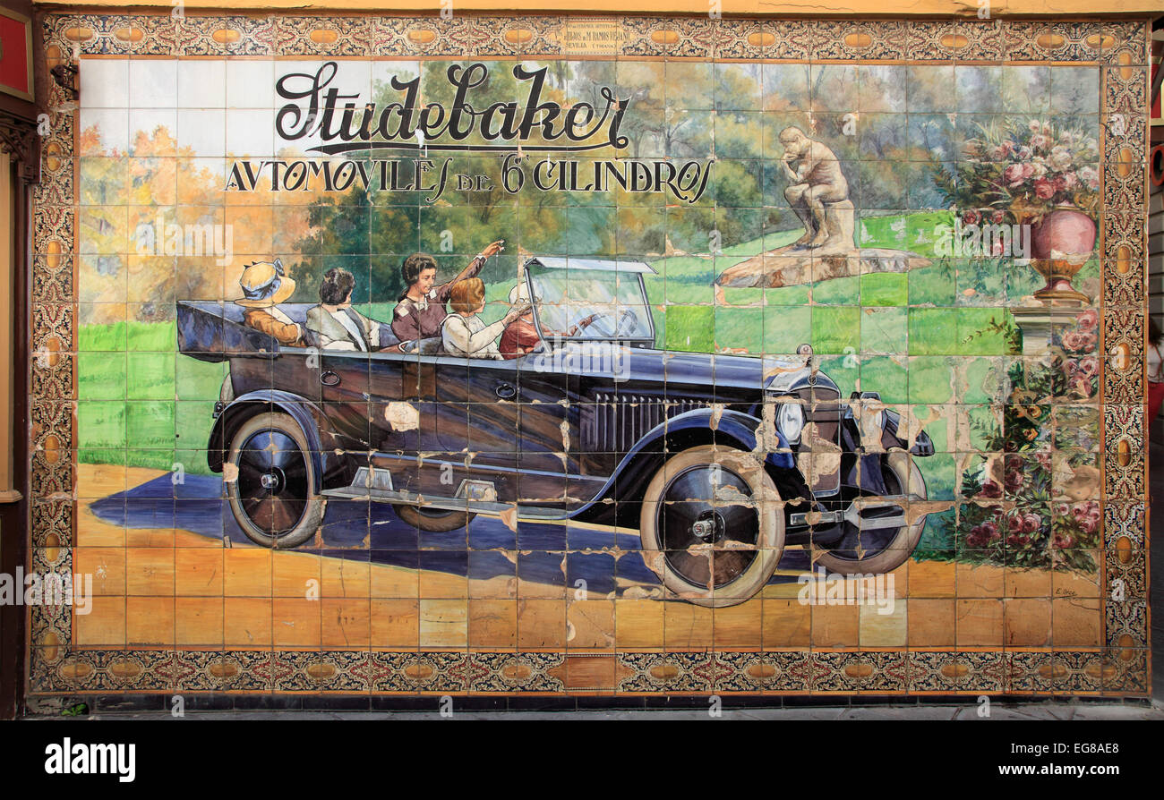 Spain, Andalusia, Seville, ceramic tile image, old car advertising, Stock Photo