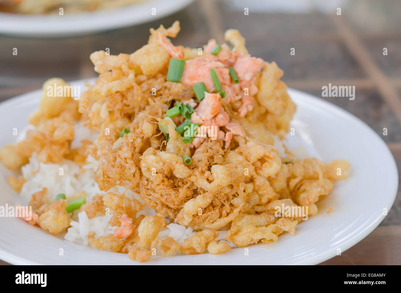 fried crispy beaten egg omelette served with steamed rice Stock Photo