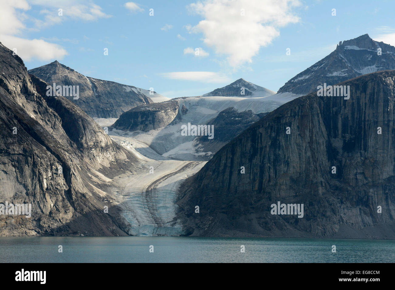 Baffin Island, Nunavut, Canada, showing glacier flowing into the sea, August Stock Photo