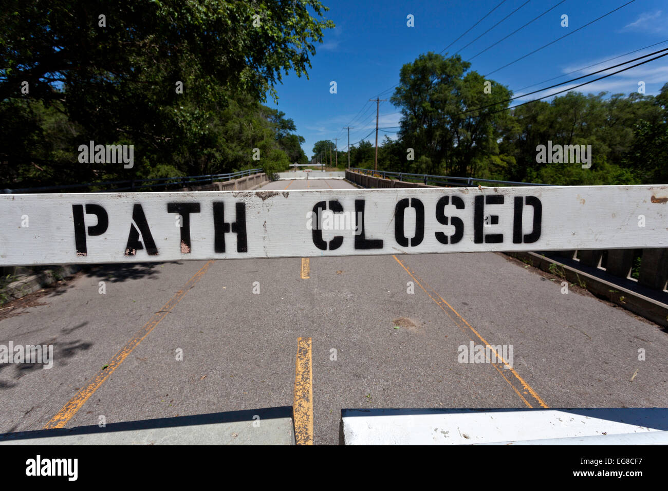 Sign which reads 'Path Closed' across a bicycle path. Stock Photo