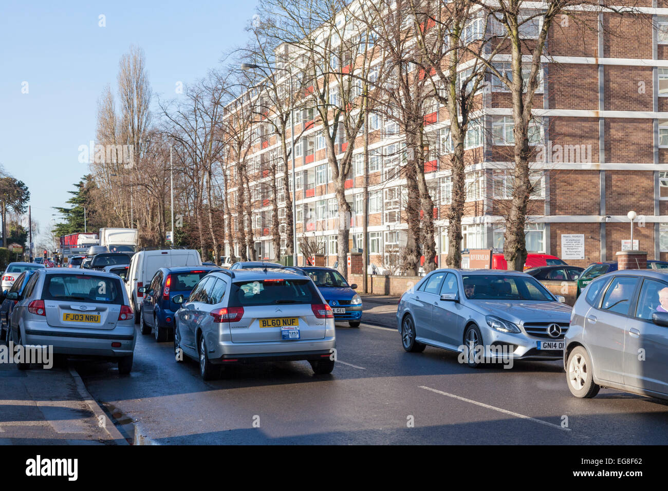 Traffic jam. Congested traffic on both sides of a residential road in winter, West Bridgford, Nottinghamshire, England, UK Stock Photo
