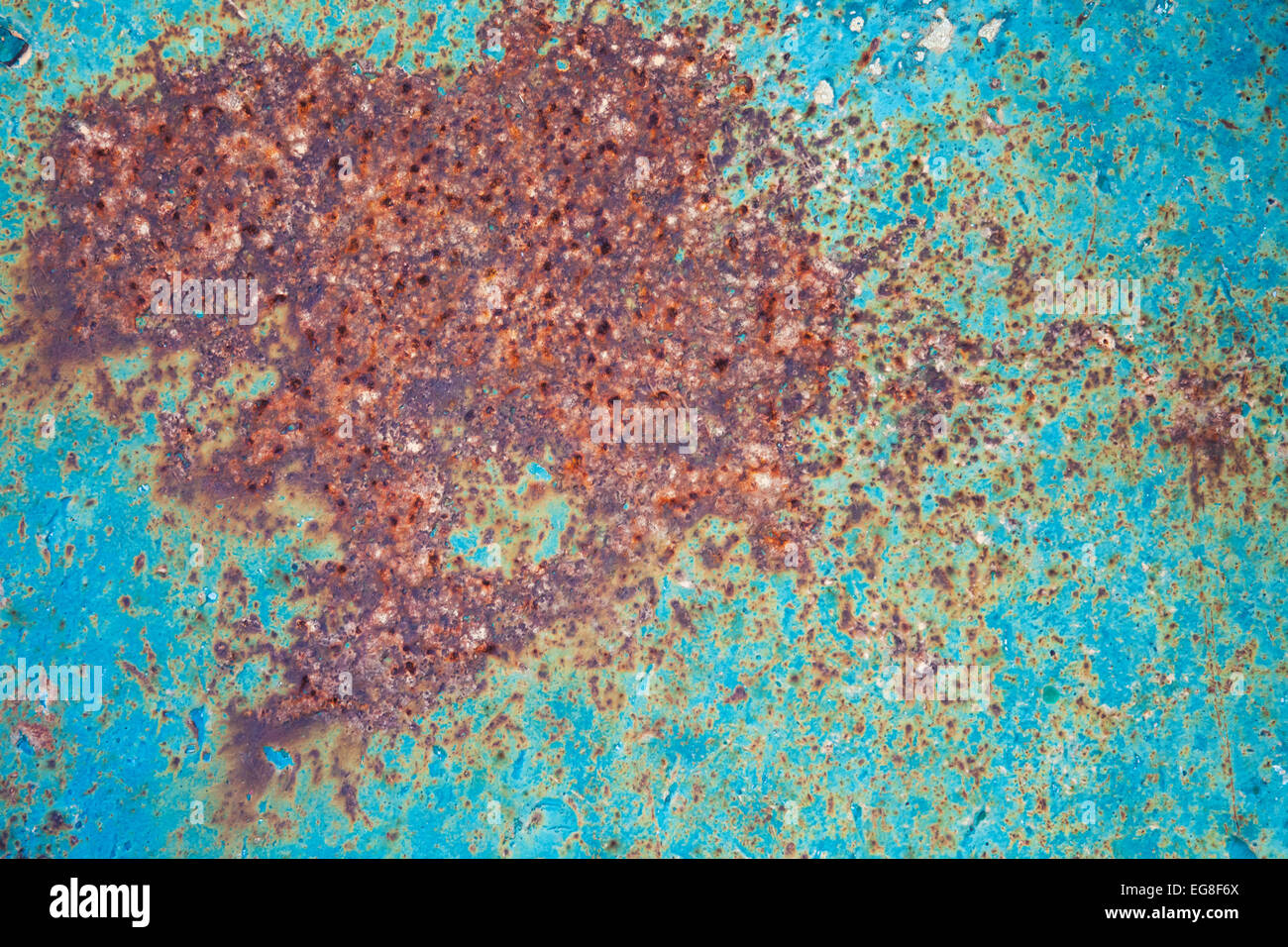 Old green grunge metal plate with big red rust spot, background photo ...