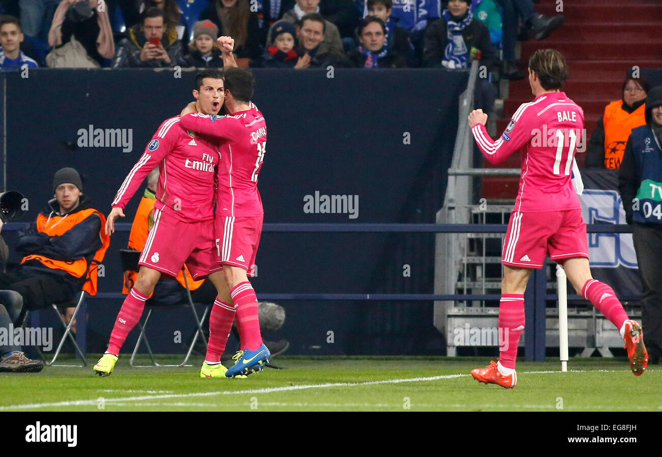 Cristiano Ronaldo (Real Madrid) (L) celebrates scoring the 1:0 with Fabio Coentrao (Real Madrid) (M) and Gareth Bale (Real Madrid) during the Champions League match between FC Schalke 04 and Real Madrid, Veltins Arena in Gelsenkirchen on February 18., 2015. Stock Photo
