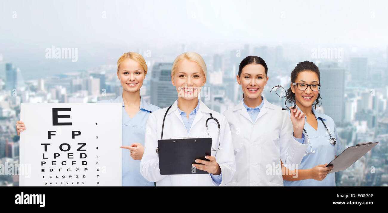 smiling female eye doctors and nurses Stock Photo
