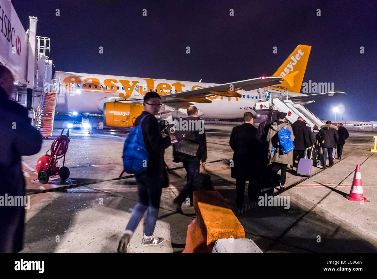 Paris, France, Passengers People Boarding Outside to AirPlane at Night