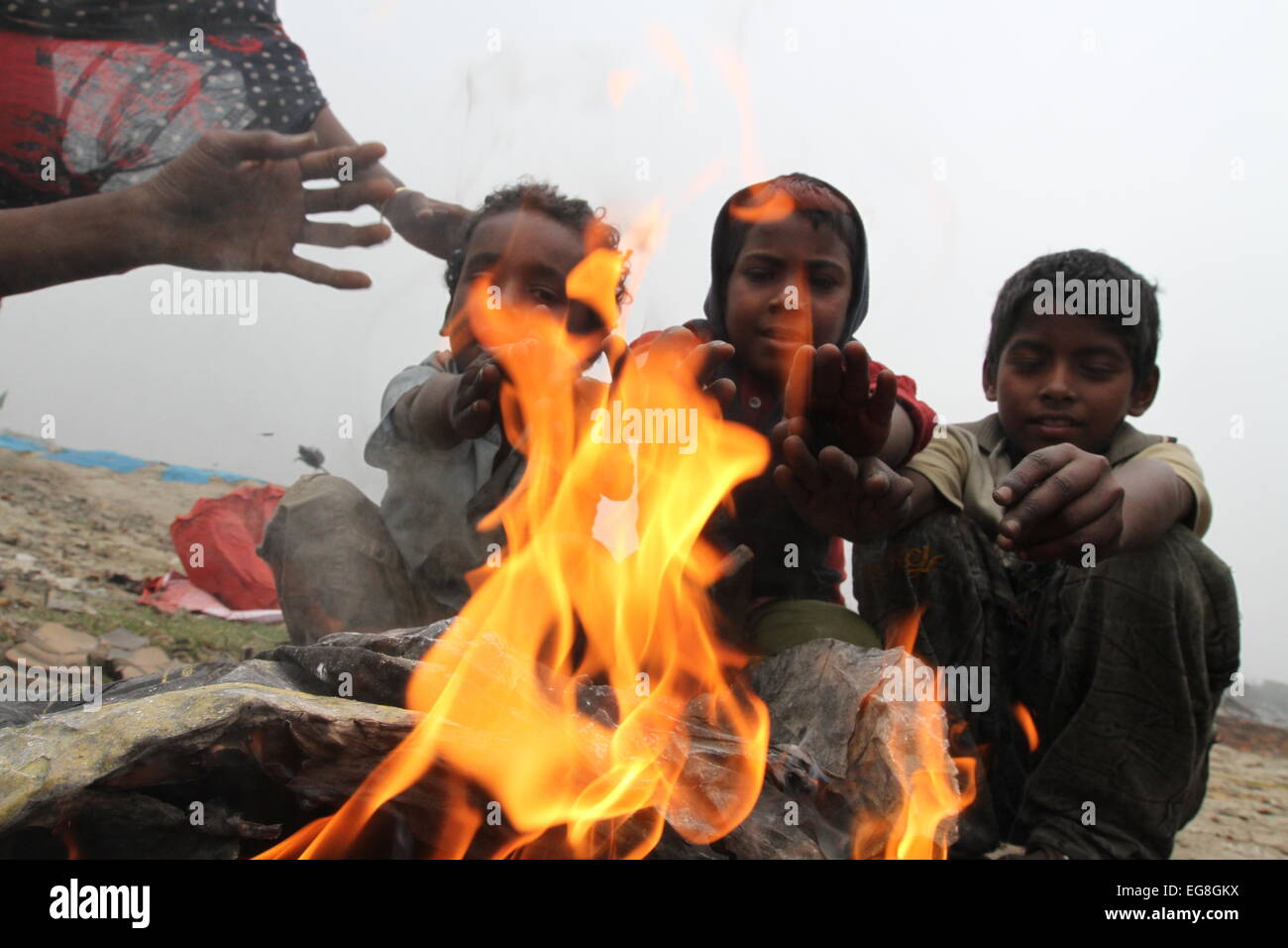 Homeless children create fire by using discarded wood or plastic to ...
