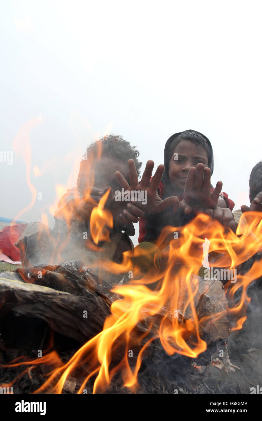 Homeless children create fire by using discarded wood or plastic to ...