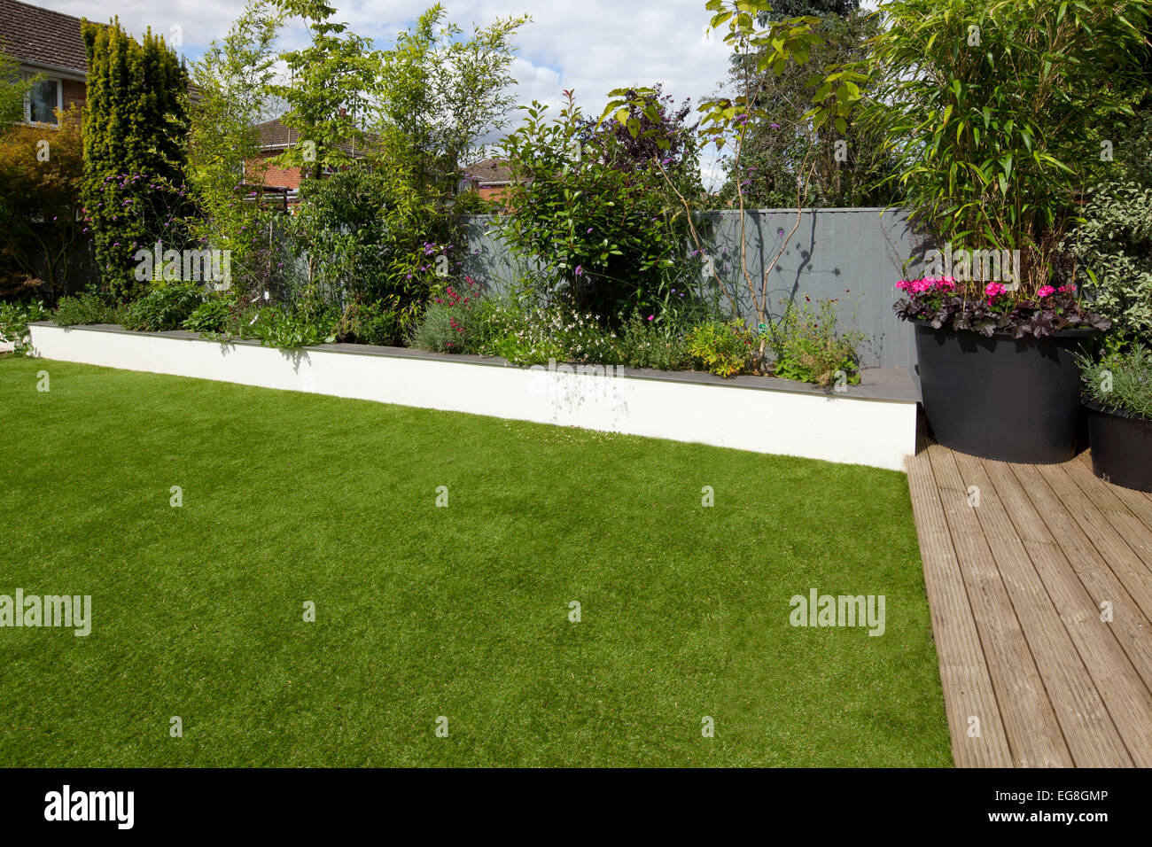 Artifical plastic fake lawn in English contemporary garden,Oxfordshire,England Stock Photo