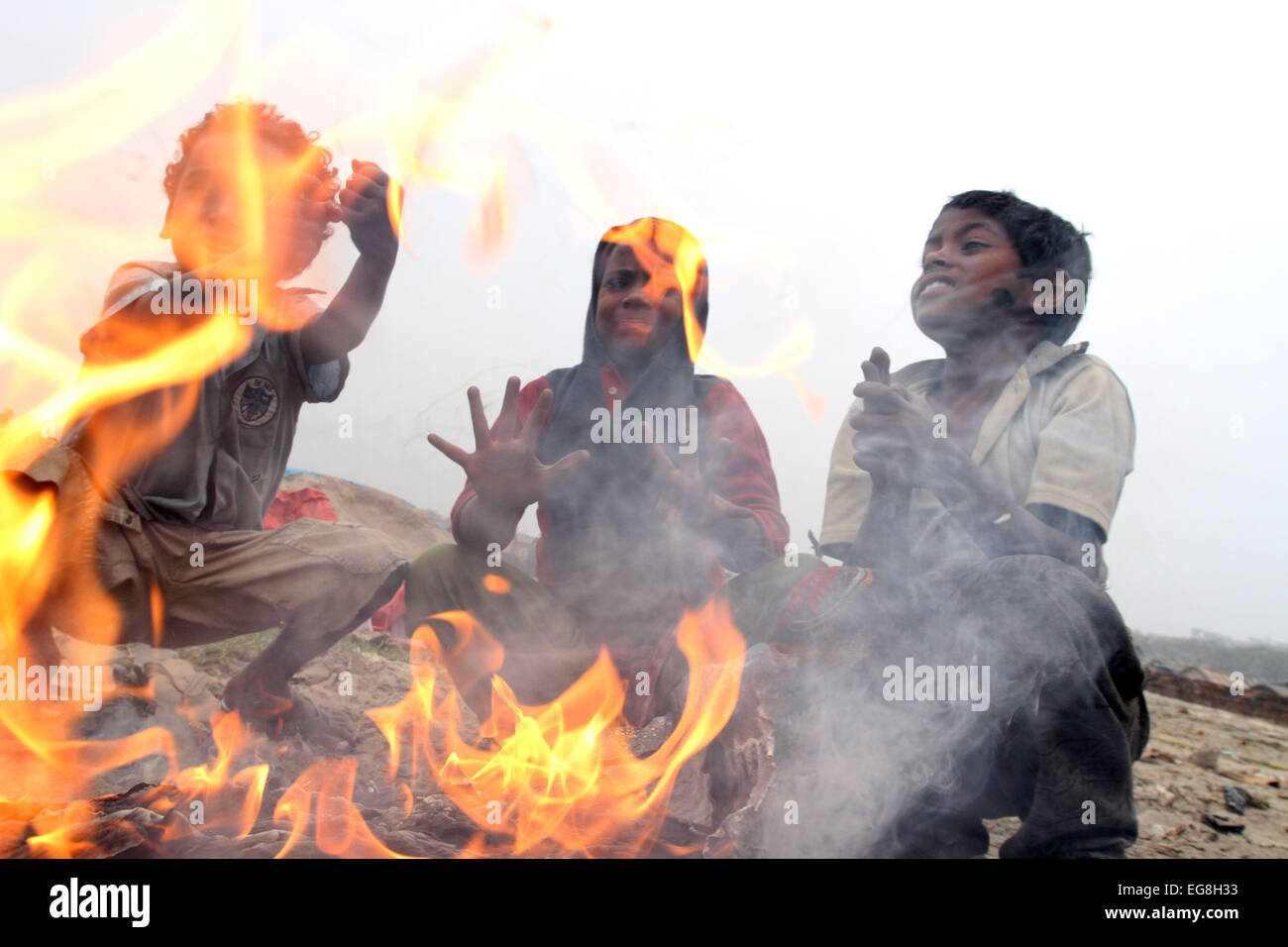 Homeless children create fire by using discarded wood or plastic to ...