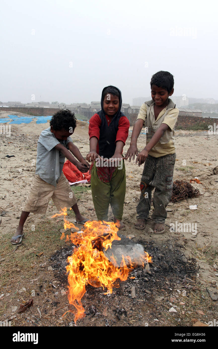Homeless children create fire by using discarded wood or plastic to ...