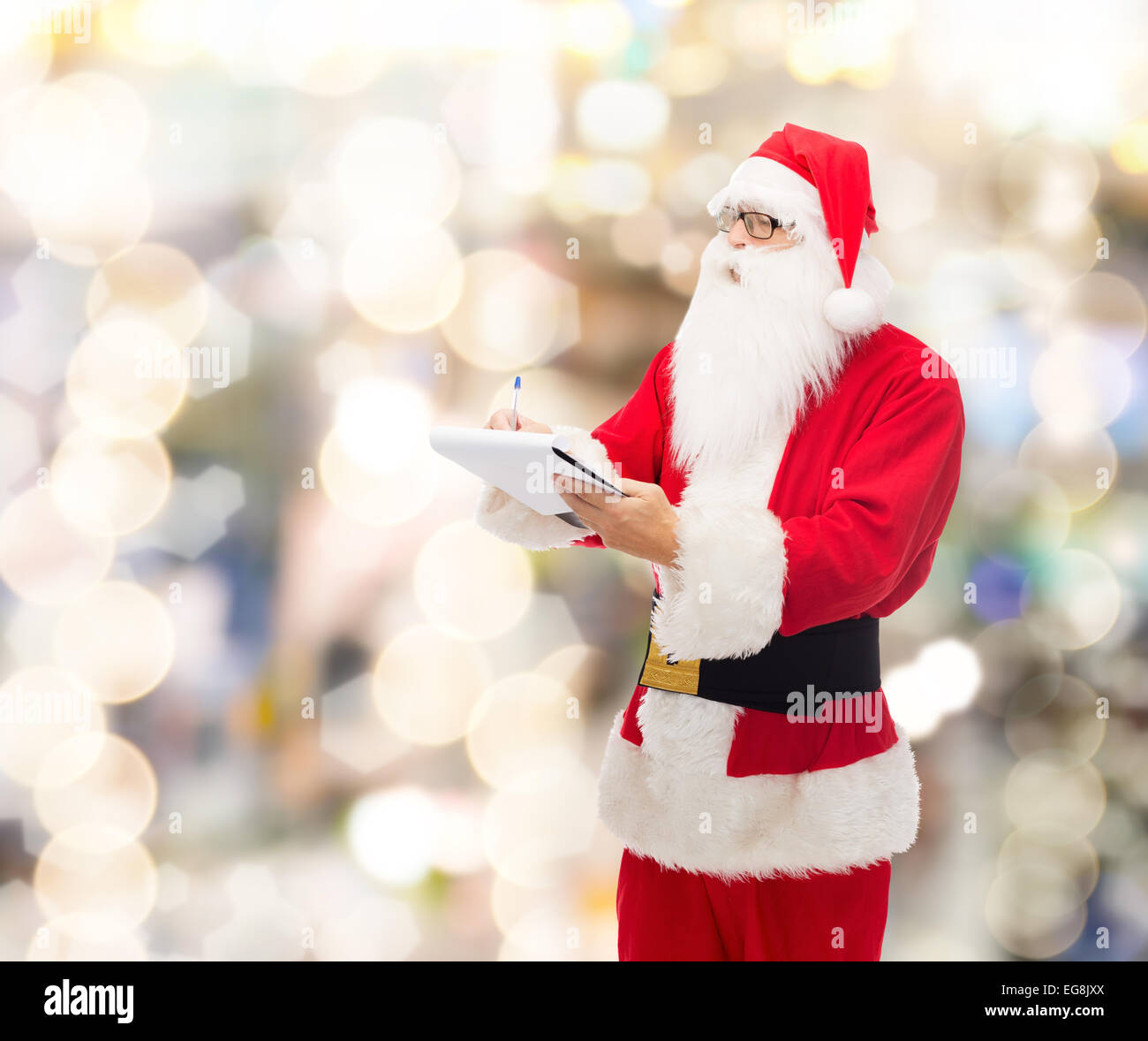 man in costume of santa claus with notepad Stock Photo - Alamy