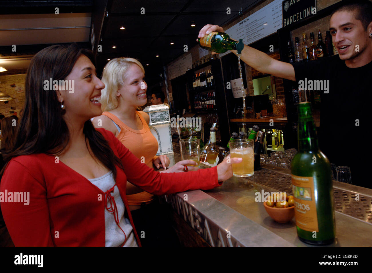 A barmen pours a new organic cider the traditional way at recently opened Camino bar Regent