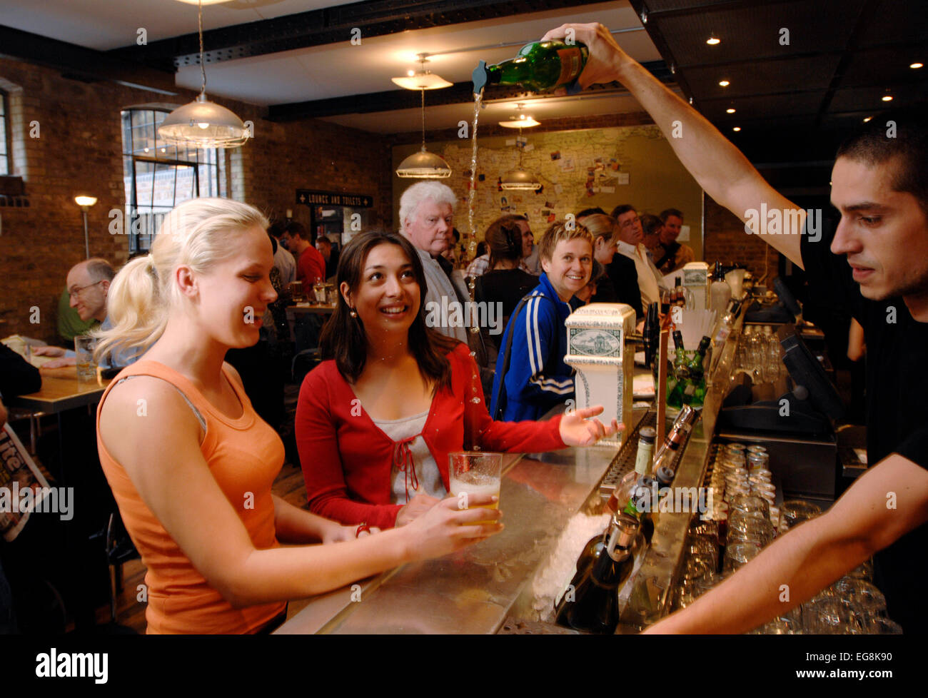 A barmen pours a new organic cider the traditional way at recently