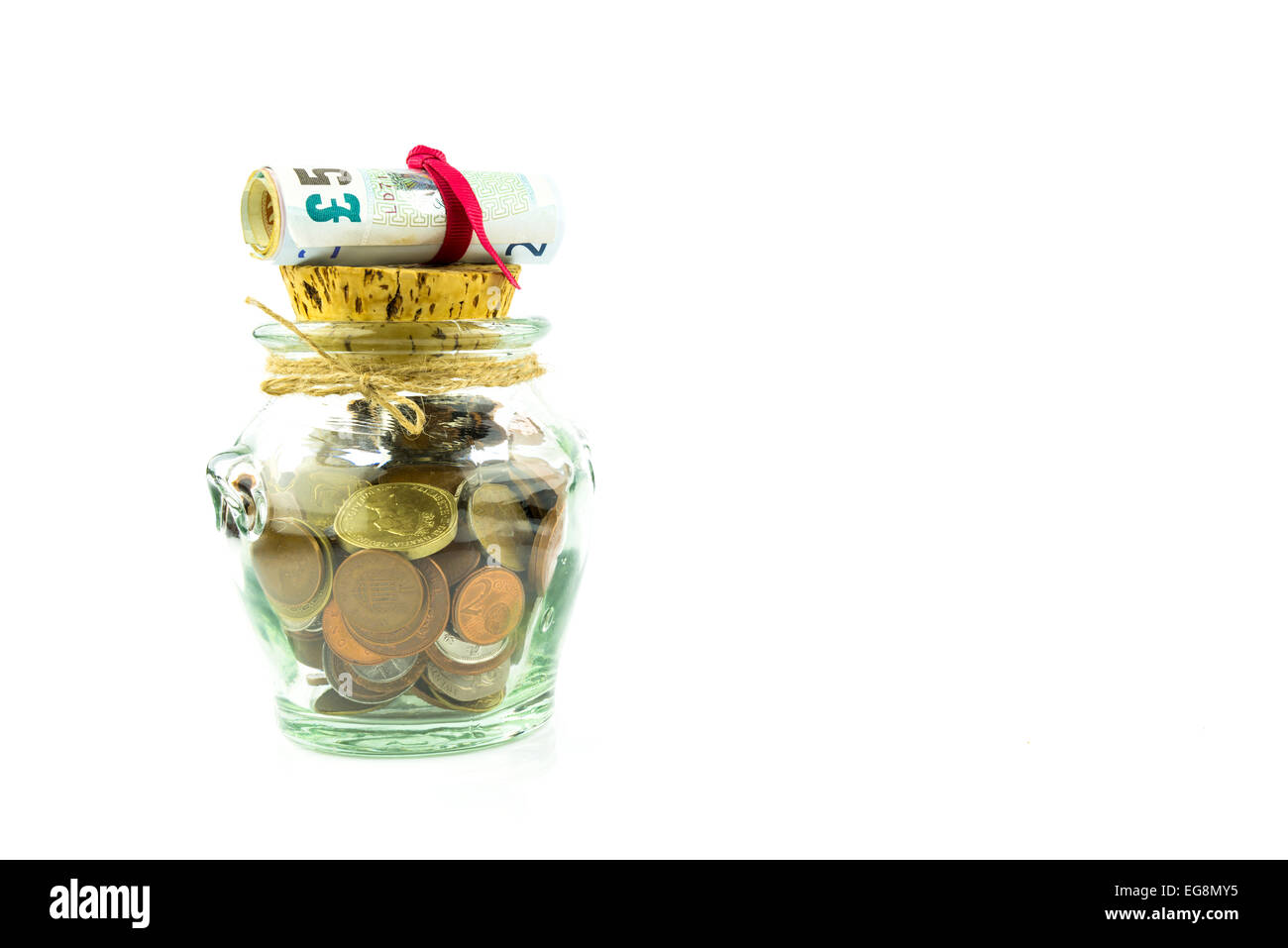 Money - coins and banknotes - in a jar on white background Stock Photo ...
